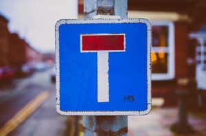 Trafikskylt med symbolen för återvändsgränd.